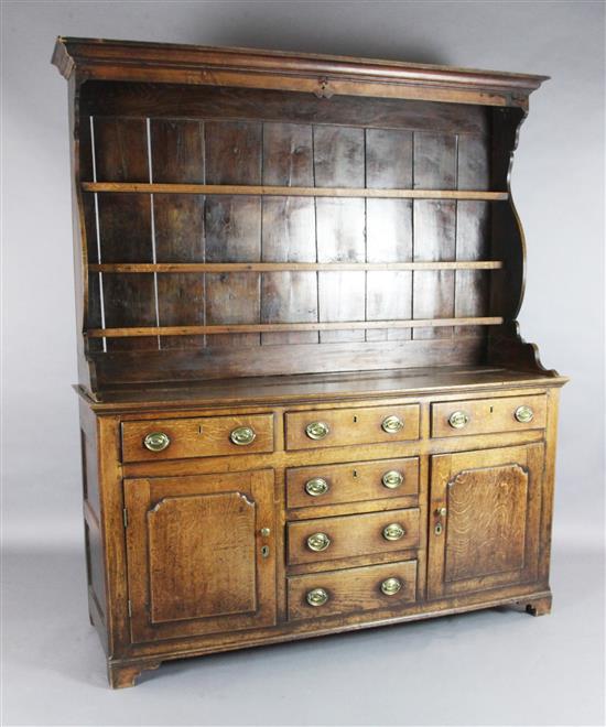 A George III oak dresser, W.5ft 10in. D.1ft 8in. H.6ft 7in.